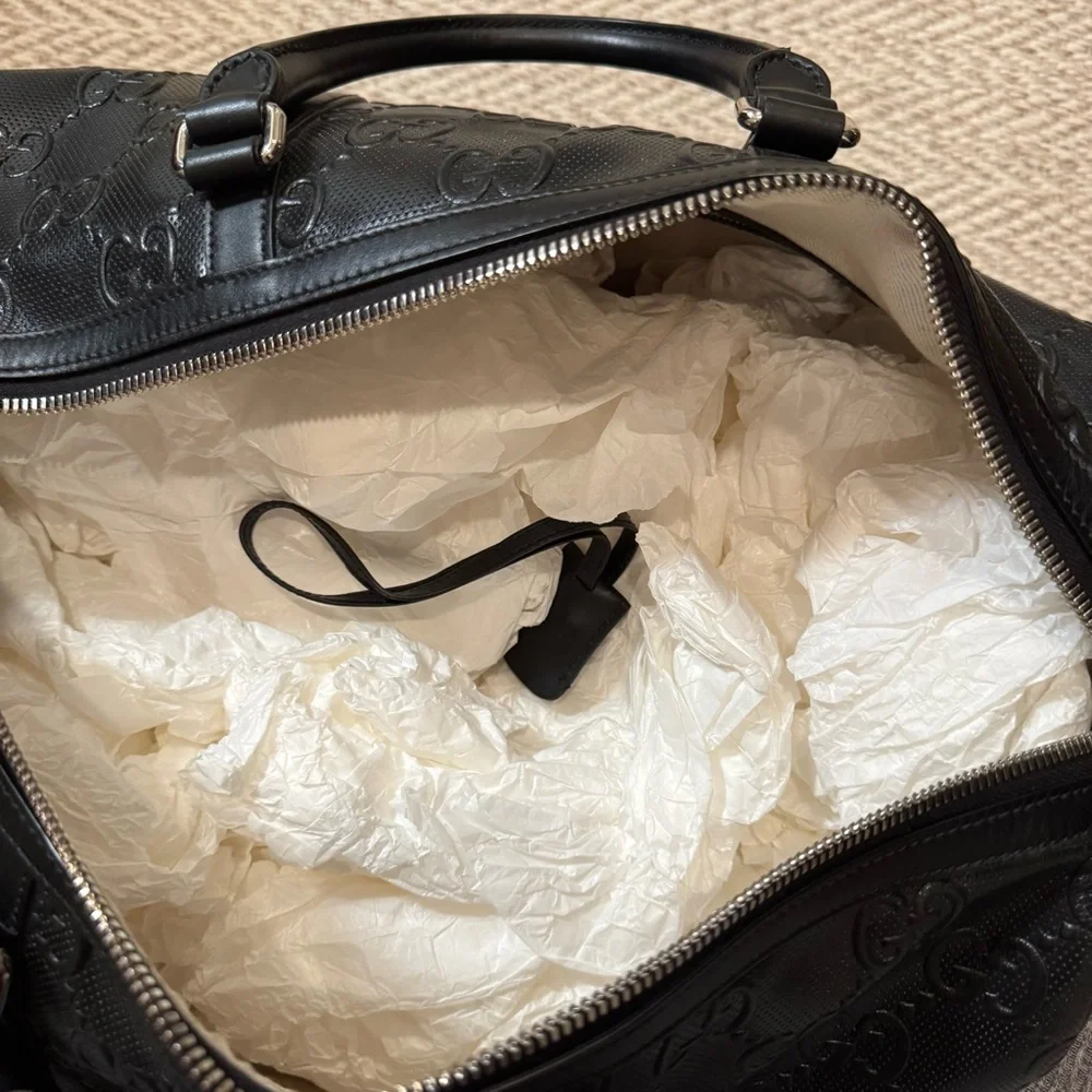 New! Gucci GG embossed black leather duffel bag